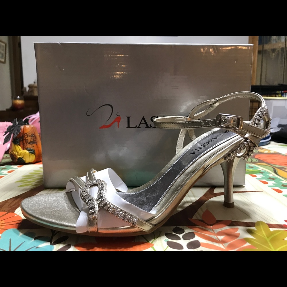 Silver high healed shoes.